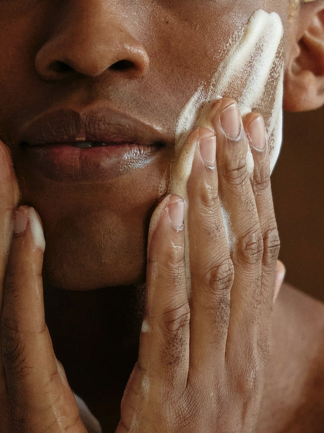 Man applies peeling to face